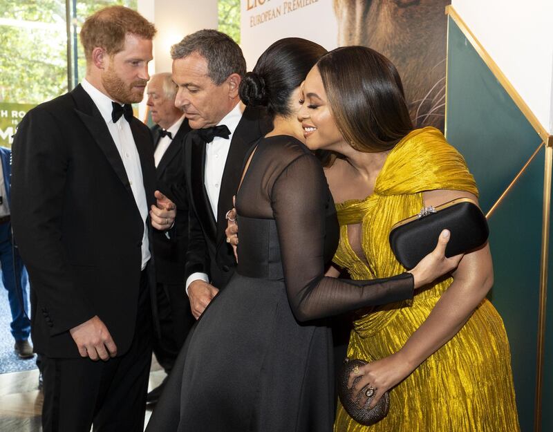 LONDON, ENGLAND - JULY 14: Prince Harry, Duke of Sussex (L) chats with Disney CEO Robert Iger as Meghan, Duchess of Sussex (2nd R) embraces Beyonce Knowles-Carter (R) as they attend the European Premiere of Disney's "The Lion King" at Odeon Luxe Leicester Square on July 14, 2019 in London, England.  (Photo by Niklas Halle'n-WPA Pool/Getty Images)