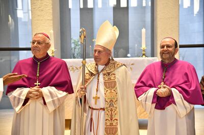 Bishop Paolo Martinelli, right, conducts the first Mass at the church on Sunday within the Abrahamic House in Abu Dhabi with Bishop Paul Hinder, left, and Cardinal Michael Fitzgerald. Photo: Apostolic Vicariate of Southern Arabia