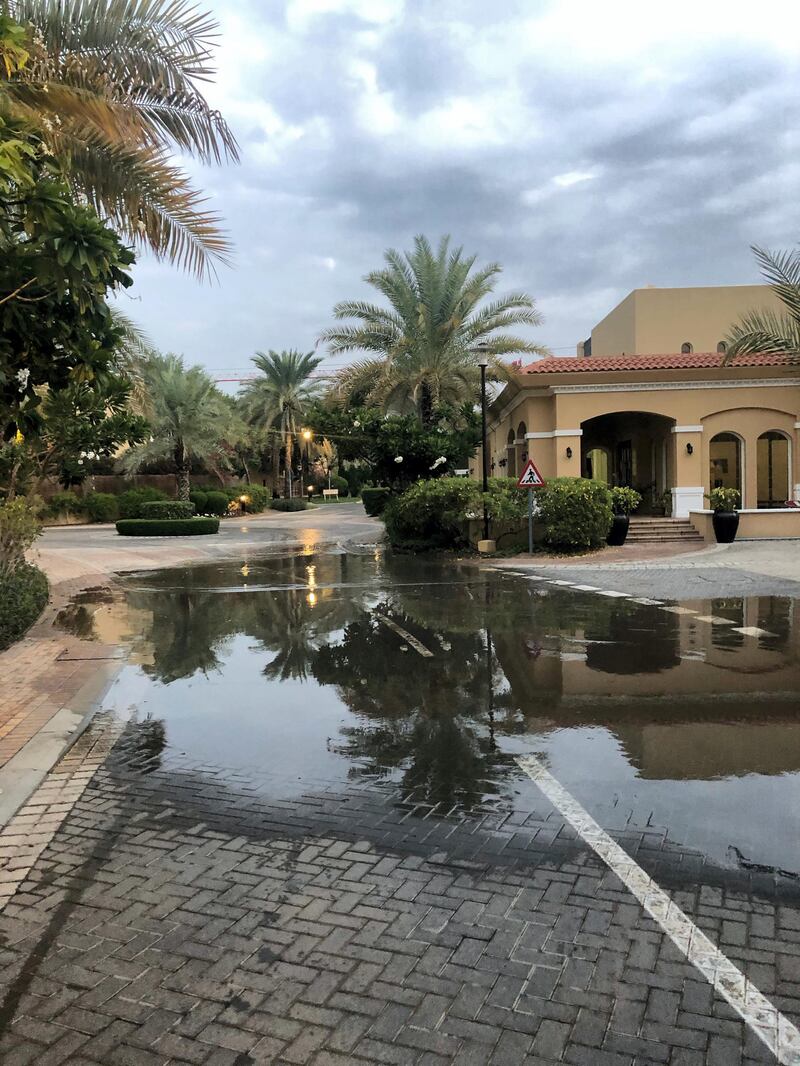 Standing water logs the streets of Knowledge Village on Sunday morning. The National