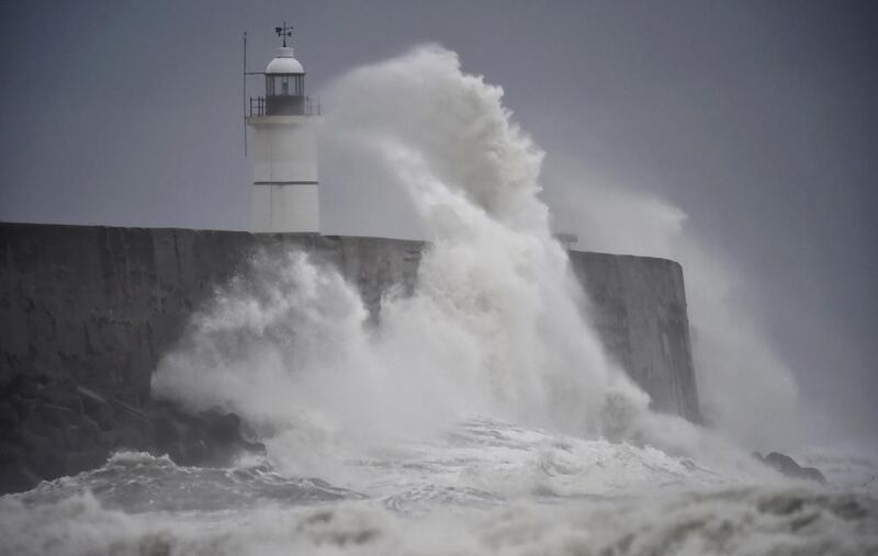 Waves crash against the harbour wall as Storm Angus passes over Newhaven in southern Britain. Hannah McKay / Reuters