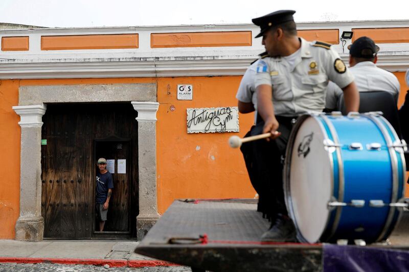 The police musical band performs for the people on a street, as the coronavirus disease (COVID-19) outbreak continues, in Guatemala City, Guatemala. REUTERS