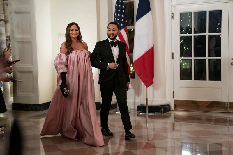 US singer John Legend and Chrissy Teigen at the White House in Washington, on December 1, 2022.  EPA