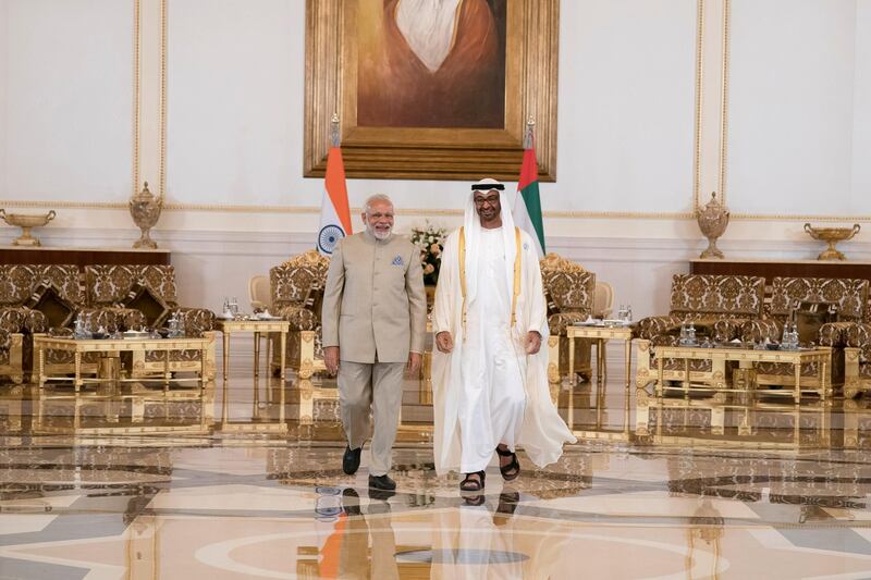 ABU DHABI, UNITED ARAB EMIRATES - February 10, 2018: HH Sheikh Mohamed bin Zayed Al Nahyan Crown Prince of Abu Dhabi Deputy Supreme Commander of the UAE Armed Forces (R), receives HE Narendra Modi Prime Minister of India (L), at the Presidential Airport.

( Omar Al Askaar for the Crown Prince Court)
---