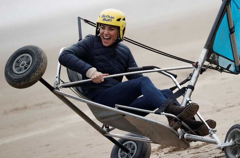 The Duchess of Cambridge swapped her baseball cap for a bright yellow safety helmet at West Sands beach, St Andrews. Phil Noble / AFP