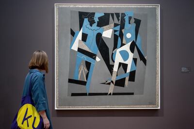 epa07468550 The artwork 'Harlequin and Woman with a Necklace' (1917) by Spanish artist Pablo Picasso is on display in the exhibition 'The Cubist Cosmos - From Picasso to Leger' at the Kunstmuseum Basel, in Basel, Switzerland, 28 March 2019. The show opens to the public from 30 March to 04 August.  EPA/GEORGIOS KEFALAS