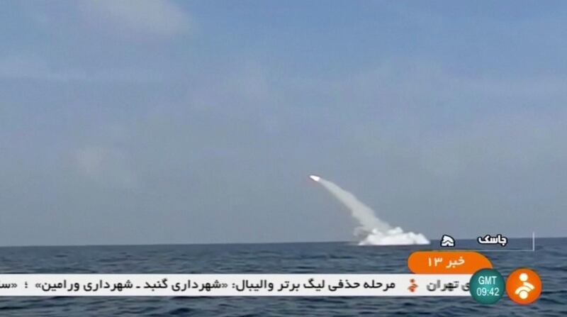 An Iranian cruise missile fires into the air from a submarine during a test at Strait of Hormuz, at the mouth of the Gulf. IRINN via Reuters TV