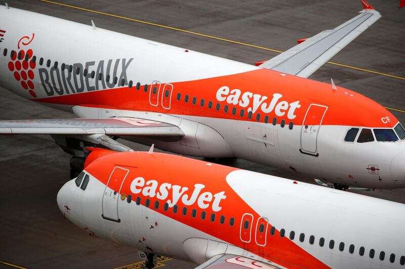 FILE PHOTO: EasyJet aircrafts are seen on the tarmac at Terminal 1, marking the official opening of the new Berlin-Brandenburg Airport (BER) "Willy Brandt", in Schoenefeld near Berlin, Germany October 31, 2020. REUTERS/Hannibal Hanschke/File Photo