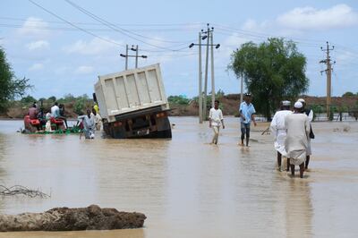 A flooded road near the village of Aboud, south of the capital Khartoum. AP 