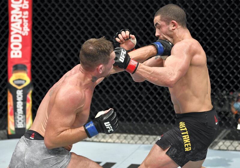 ABU DHABI, UNITED ARAB EMIRATES - JULY 26: (L-R) Darren Till of England punches Robert Whittaker of New Zealand in their middleweight fight during the UFC Fight Night event inside Flash Forum on UFC Fight Island on July 26, 2020 in Yas Island, Abu Dhabi, United Arab Emirates. (Photo by Jeff Bottari/Zuffa LLC via Getty Images)