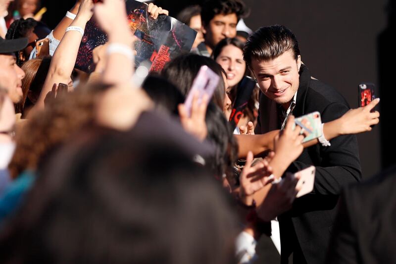 US actor Joe Keery (right) interacts with fans on the red carpet prior to the premiere of 'Stranger Things: Season 3' in Santa Monica, California.  EPA