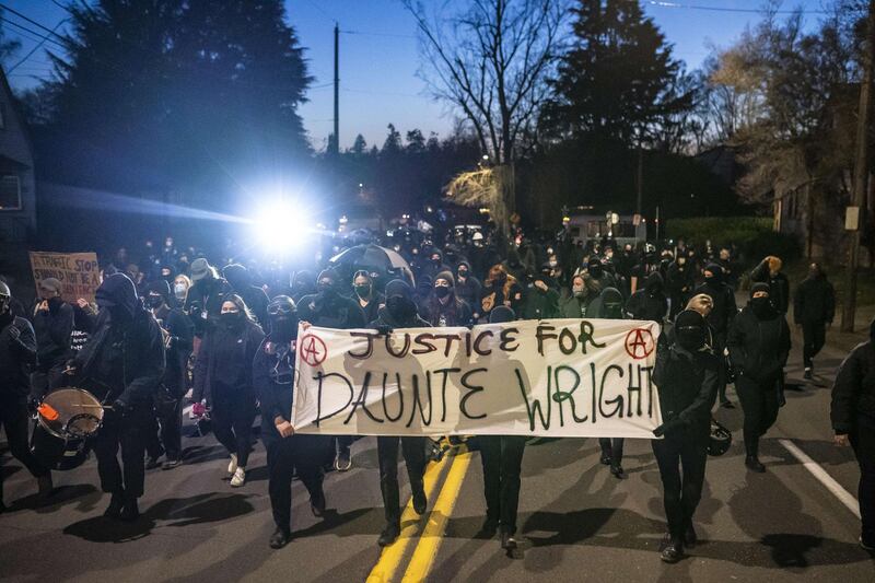 PORTLAND, OR - APRIL 12: Activists march towards the Multnomah County Sheriff's office during a protest against the killing of Daunte Wright on April 12, 2021 in Portland, Oregon. Wright, a Black man whose car was stopped in Brooklyn Center, Minnesota on Sunday reportedly for an expired registration, and not far from where George Floyd was killed during an arrest in Minneapolis last May, was shot and killed by an officer who police say mistook her service revolver for a Taser.   Nathan Howard/Getty Images/AFP
== FOR NEWSPAPERS, INTERNET, TELCOS & TELEVISION USE ONLY ==
