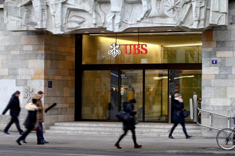 FILE PHOTO: People walk past a branch office of Swiss bank UBS in Zurich, Switzerland January 27, 2017. REUTERS/Arnd Wiegmann/File Photo