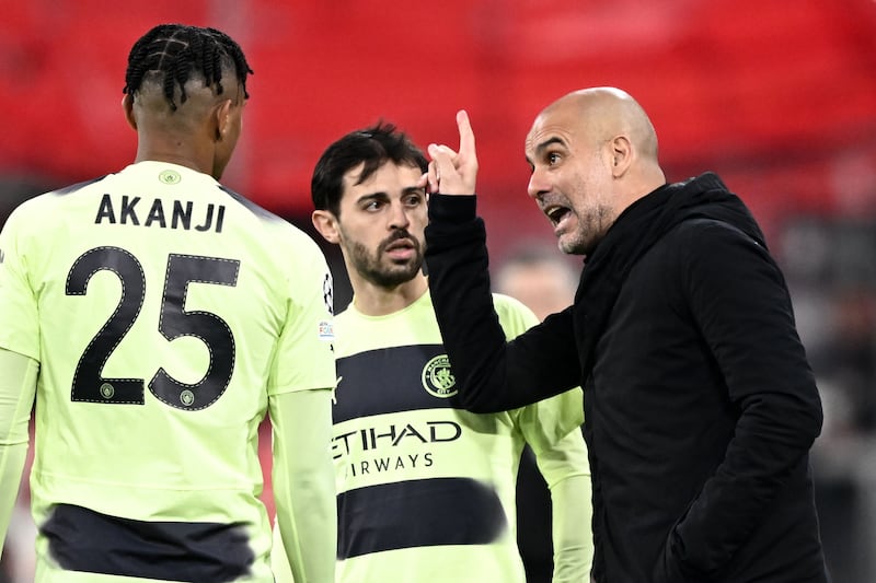 Manchester City manager Pep Guardiola, right, gives instructions to Bernardo Silva, centre, and Manuel Akanji during the Champions League game against Bayern Munich. EPA