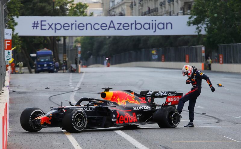 Formula One F1 - Azerbaijan Grand Prix - Baku City Circuit, Baku, Azerbaijan - June 6, 2021 Red Bull's Max Verstappen kicks the wheel of his car after crashing out of the race REUTERS/Anton Vaganov