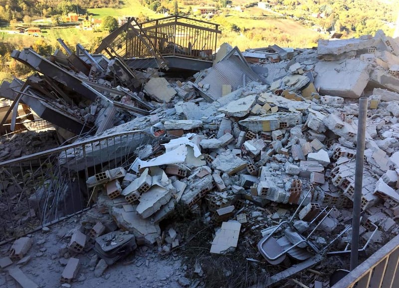 Rubble of a collapsed building in L’Aquila.   Alberto Orsini / ANSA via AP