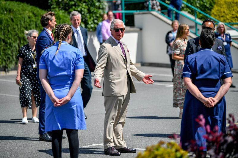 ST. AUSTELL, ENGLAND - JULY 21: Prince Charles, The Duke of Cornwall chats with care workers as he visits St Austell Healthcare, the Wheal Northey Centre, to recognise and thank staff for their efforts during Covid-19 pandemic on July 21, 2020 in St Austell, England. (Photo by Ben Birchall -WPA Pool/Getty Images)