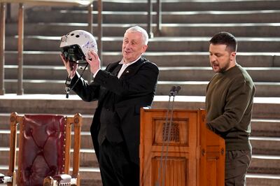 Volodymyr Zelenskyy gave an airman's helmet to House of Commons Speaker Lindsay Hoyle to make a point about fighter jets. Getty 