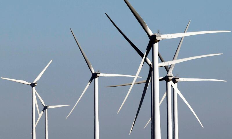 General view shows wind turbines on a slope above fields in Villeveyrac, France, October 30, 2016. REUTERS/Regis Duvignau - RTX2R3CA