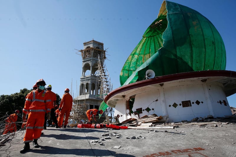 Rescuers look for survivors after an earthquake struck northern Lombok. EPA