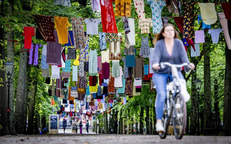 Dresses donated by survivors of sexual violence hang from clothes lines across the Lange Voorhout, in The Hague, Netherlands. The art installation, Thinking of You by Alketa Xhafa Mripa, aims to raise awareness of people who have experienced sexual violence during war. EPA