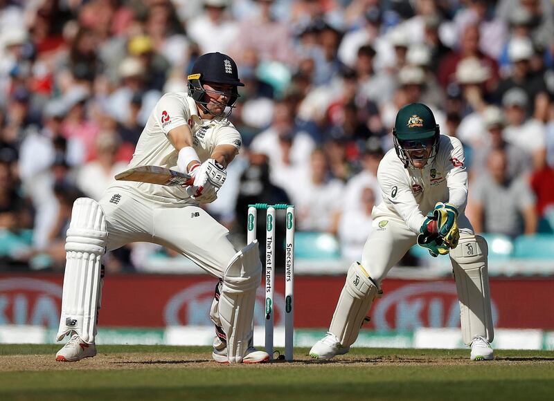 Australia wicketkeeper Tim Paine  takes a catch to dismiss Rory Burns of England. Getty