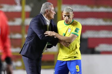 Richarlison (R) celebrates a goal with Brazil's coach Adenor Leonardo Bacchi 'Tite', during a South American qualifying match for the Qatar 2022 World Cup between Bolivia and Brazil, at the Hernando Siles Stadium, in La Paz, Bolivia, 29 March 2022.   EPA / Martin Alipaz
