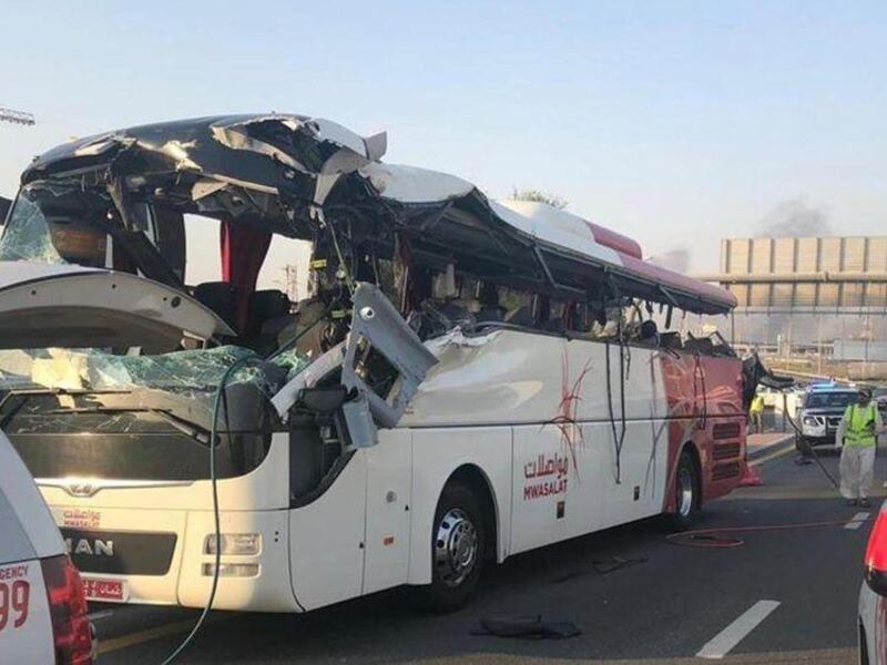 The solid-steel barrier cut through the bus at seat height. Dubai Police