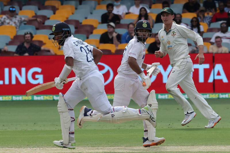 India batsmen Cheteshwar Pujara and Rishabh Pant run between the wickets. AFP