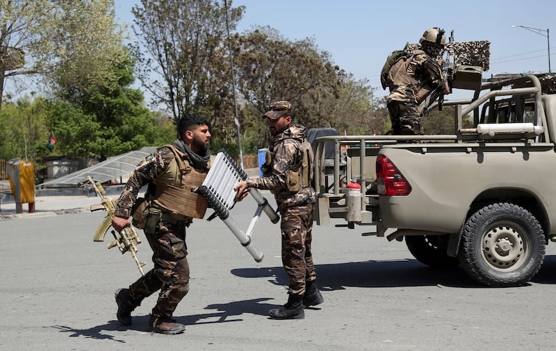 Afghan Security personnel arrive outside the Telecommunication Ministry during a gunfight with insurgents in Kabul, Afghanistan, Saturday, April 20, 2019. Afghan officials say an explosion has rocked the telecommunications ministry in the capital city of Kabul. Nasart Rahimi, a spokesman for the interior ministry, said Saturday the blast occurred during a shootout with security forces. (AP Photo/Rahmat Gul)