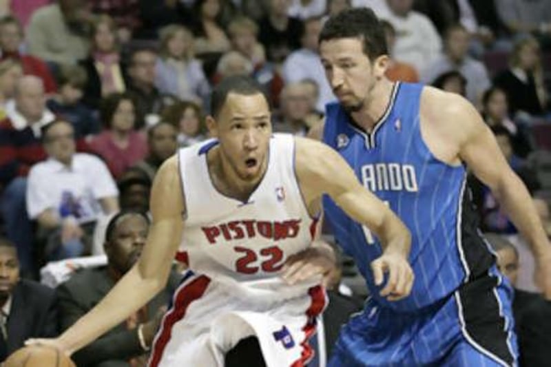 The Detroit Pistons' Tayshaun Prince, left, drives to the basket against the Orlando Magic's Hedo Turkoglu on Monday.
