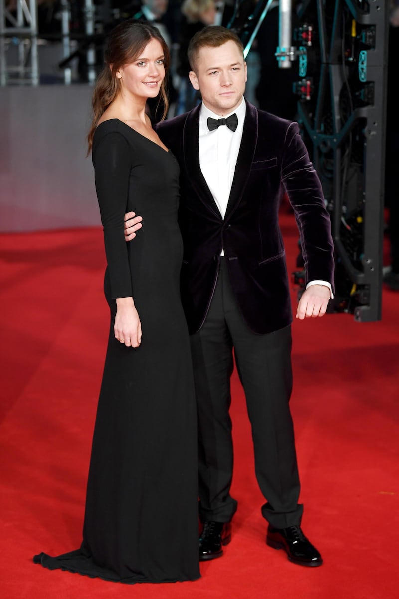 Taron Egerton and Emily Thomas arrives at the 2020 EE British Academy Film Awards at London's Royal Albert Hall on Sunday, February 2. EPA
