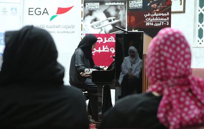 ABU DHABI - UNITED ARAB EMIRATES - 04APRIL2016 - Eman Al Hashimi on piano performing Music In Hospitals for patients, its the first event in Abu Dhabi Festival's month-long community & education programme held at Sheikh Khalifa Medical City (SKMC) yesterday in Abu Dhabi. Ravindranath K / The National (for News)
ID: 93523 *** Local Caption ***  RK0404-music01.jpg