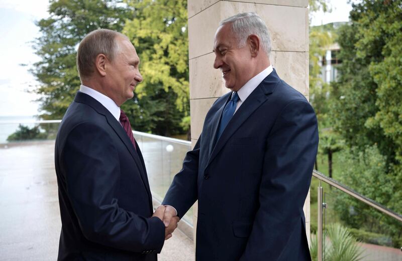 Russian President Vladimir Putin, left, and Israeli Prime Minister Benjamin Netanyahu shake hands during their meeting in Sochi, Russia, Wednesday, Aug. 23, 2017. (Alexei Nikolsky, Sputnik, Kremlin Pool Photo via AP)