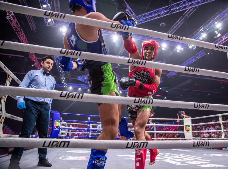 Ilyass Habibali of UAE, in red, defeats Mustafa Al Tekreet of Iraq.