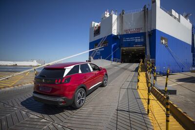 A new red right hand drive Peugeot 3008 sports utility vehicle (SUV), manufactured by PSA Group, drives onto the roll-on/roll-off (RORO) vehicle carrier Glovis Passion, operated by Ray Car Carriers Ltd., before export to Sheerness, U.K., at the Port of Zeebrugge in Zeebrugge, Belgium, on Monday, May 7, 2018. With Brexit due in 10 months, Zeebrugge embodies the repeated warnings by the U.K.’s EU partners that its departure from the bloc is a lose-lose move by adding bureaucracy for businesses and costs for consumers. Photographer: Jasper Juinen/Bloomberg