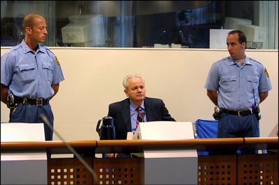 Former Yugoslav strongman Slobodan Milosevic appears before the Yugoslav war crimes tribunal in the Hague in 2001. Getty Images