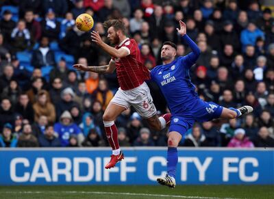 Soccer Football - Championship - Cardiff City vs Bristol City - Cardiff City Stadium, Cardiff, Britain - February 25, 2018  Cardiff City’s Gary Madine in action with Bristol City’s Nathan Baker  Action Images/Tony O'Brien  EDITORIAL USE ONLY. No use with unauthorized audio, video, data, fixture lists, club/league logos or "live" services. Online in-match use limited to 75 images, no video emulation. No use in betting, games or single club/league/player publications. Please contact your account representative for further details.     TPX IMAGES OF THE DAY