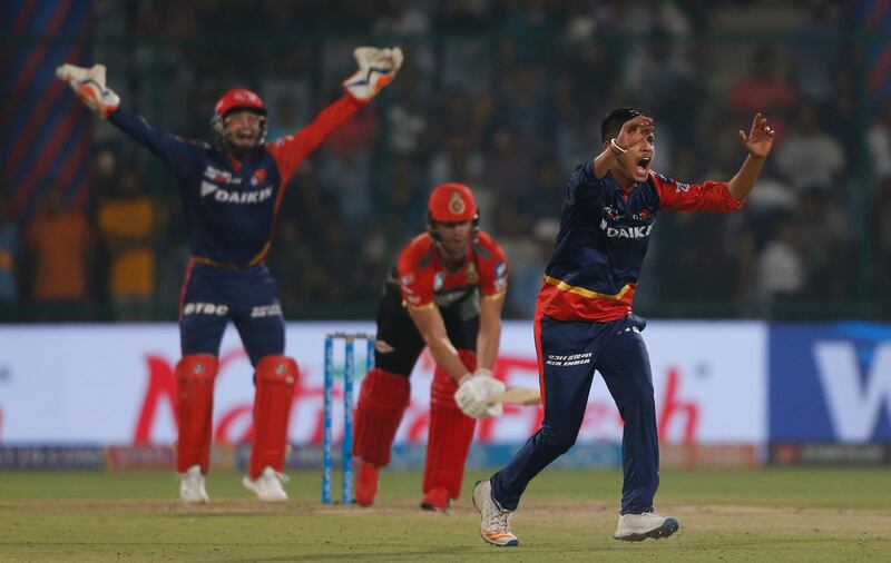 Delhi Daredevils' bowler Sandeep Lamichhane, right, and wicketkeeper Rishabh Pant appeals unsuccessfully during VIVO IPL cricket T20 match against Royal Challengers Bangalore in New Delhi, India, Saturday, May 12, 2018. (AP Photo/Altaf Qadri)