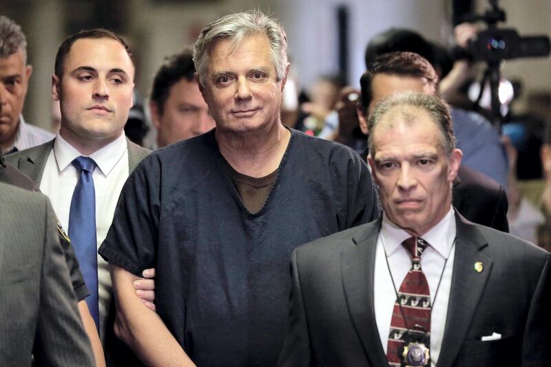 FILE- In this June 27, 2019 file photo, Paul Manafort, center, arrives at court in New York.  New York City prosecutors are seeking to have the state‚Äôs highest court revive state mortgage fraud charges against Manafort after striking out twice before in lower courts. The Manhattan district attorney‚Äôs office sent a letter Tuesday, Nov. 24, 2020, to the state‚Äôs chief judge asking permission to challenge an intermediate appeals court‚Äôs ruling last month, which upheld a judge‚Äôs decision to dismiss the case on double jeopardy grounds.(AP Photo/Seth Wenig, File)