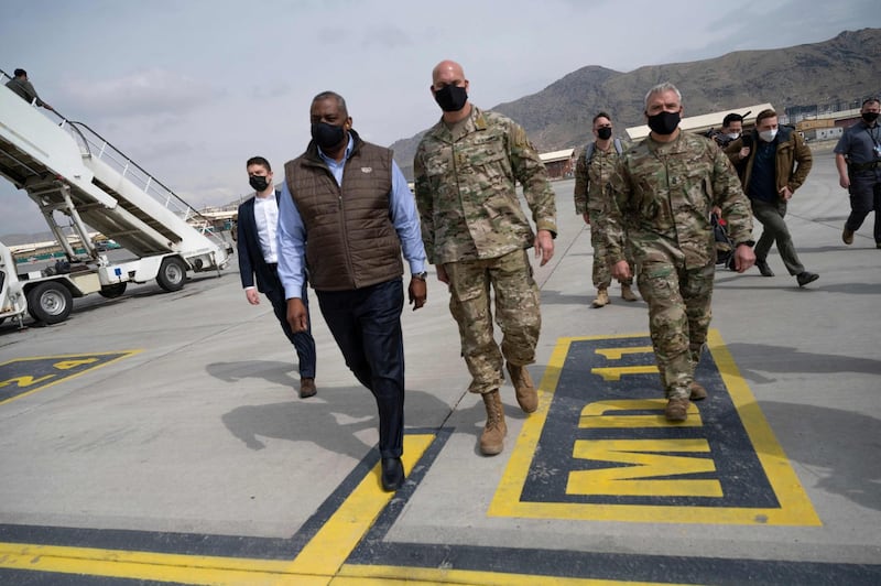 This US Department of Defense photo released March 23, 2021 shows US Secretary of Defense Lloyd J. Austin III(2ndL) walking with the commander of Combined Security Transition Command – Afghanistan, Army Lt. Gen. E. John Deedrick Jr., upon arrival in Kabul, Afghanistan, March 21, 2021.  US Defense Secretary Lloyd Austin made an unannounced visit to Afghanistan on March 21, 2021 just weeks before Washington is due to withdraw the last of its troops under a deal struck with the Taliban last year. - RESTRICTED TO EDITORIAL USE - MANDATORY CREDIT "AFP PHOTO /US Department of Defense/LISA FERDINANDO/HANDOUT " - NO MARKETING - NO ADVERTISING CAMPAIGNS - DISTRIBUTED AS A SERVICE TO CLIENTS
 / AFP / DoD / Lisa Ferdinando / RESTRICTED TO EDITORIAL USE - MANDATORY CREDIT "AFP PHOTO /US Department of Defense/LISA FERDINANDO/HANDOUT " - NO MARKETING - NO ADVERTISING CAMPAIGNS - DISTRIBUTED AS A SERVICE TO CLIENTS
