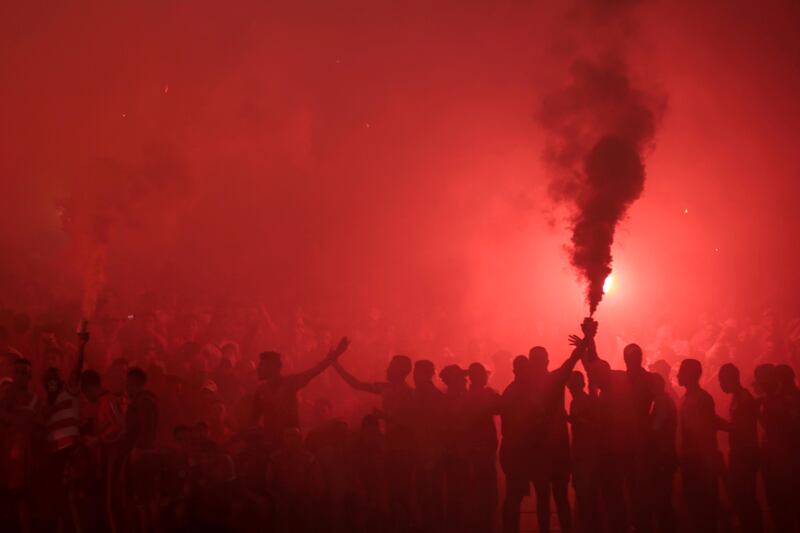 Supporters of Morocco's Wydad Athletic Club lights flares during the second leg of the CAF Champions League final soccer match against Egypt's Al Ahly Sporting Club, in Casablanca, Morocco. Mosa'ab Elshamy / AP Photo