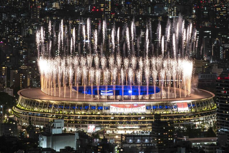 Fireworks light up the sky over the Olympic Stadium during the closing ceremony of the Tokyo 2020 Olympic Games.