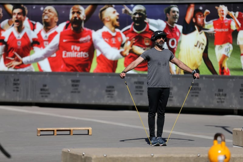A man exercises outside Arsenal's Emirates Stadium in north London. AFP