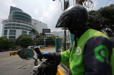 A Gojek driver in Jakarta, Indonesia. TikTok agreed to invest $1. 5 billion in a joint venture with Gojek's parent company, the GoTo Group, part of a pact that lets the Chinese company restart its shopping app in its biggest online-retail market. Bloomberg