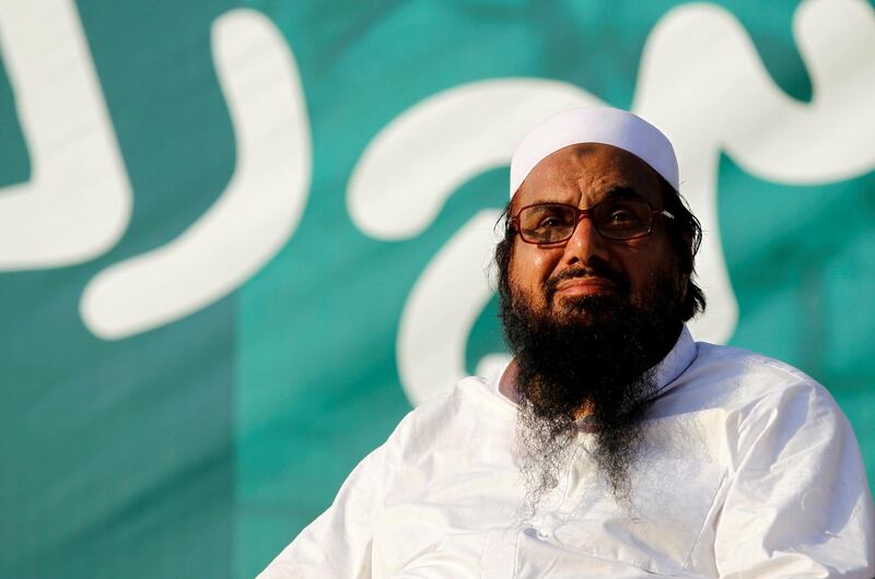 FILE PHOTO: Hafiz Muhammad Saeed, chief of the banned Islamic charity Jamat-ud-Dawa, looks over the crowed as they end a "Kashmir Caravan" from Lahore with a protest in Islamabad, Pakistan July 20, 2016. REUTERS/Caren Firouz/File Photo