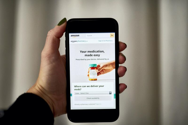 The Amazon Pharmacy home screen on a smartphone arranged in the Brooklyn Borough of New York, U.S., on Tuesday, Nov. 17, 2020. Amazon.com Inc. unveiled its biggest push into selling prescription drugs with the launch of a digital pharmacy and discounts for paying U.S. Prime members that sent shock waves through shares of drugstore chains and distributors. Photographer: Gabby Jones/Bloomberg
