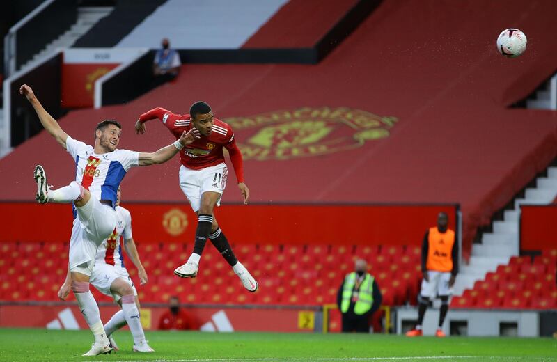 Manchester United substitute Mason Greenwood (R) heads a chance wide. AFP