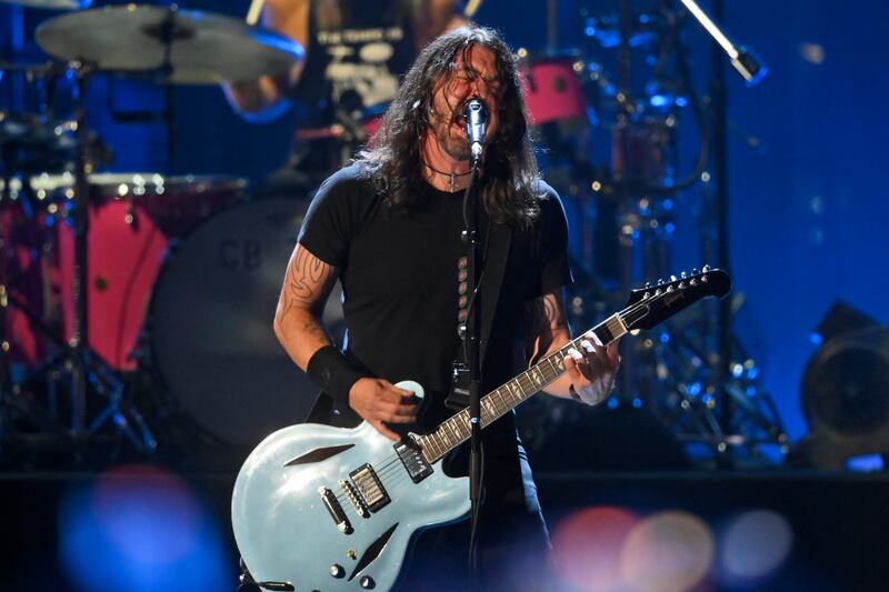 Foo Fighters, led by frontman Dave Grohl, should arrive at Etihad Park rejuvenated with new member Josh Freese. AP