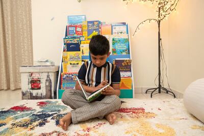 DUBAI, UNITED ARAB EMIRATES. 15 MARCH 2020. Parents thinking outside of the box to keep their kids engaged and entertained now that schools are closed. Zayyan Furquan(6) reading abook in the reading corner his parents set up for him at home. (Photo: Antonie Robertson/The National) Journalist: Patrick Ryan. Section: National. 
