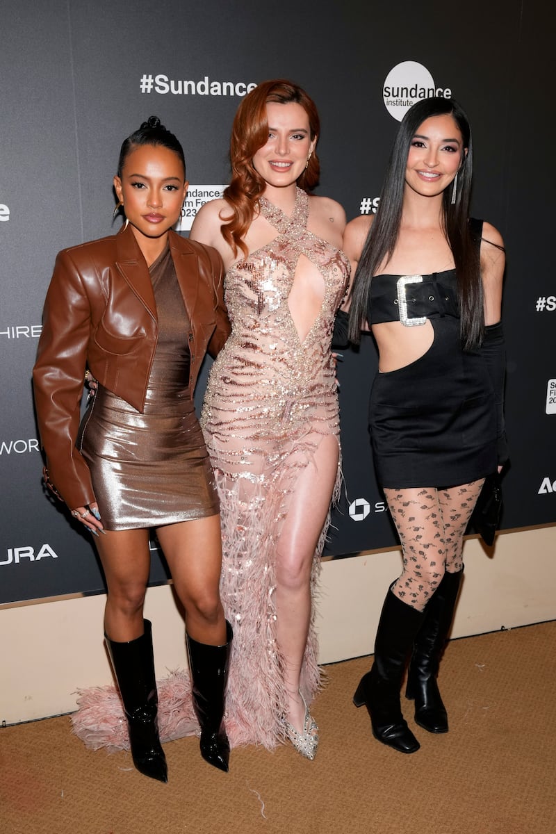 From left, Karrueche Tran, Bella Thorne and Emily Willis attend the premiere of Divinity at the Egyptian Theatre on January 21, 2023. Invision / AP